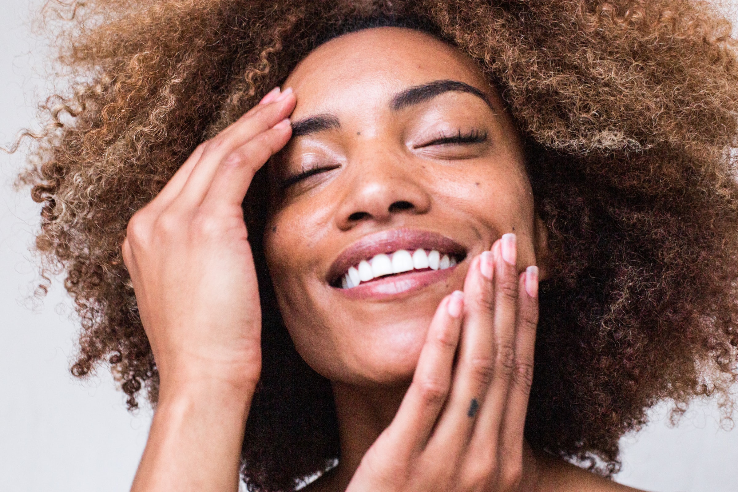 Woman with hands on face